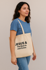Woman holding a beige Jesus & tote bag 