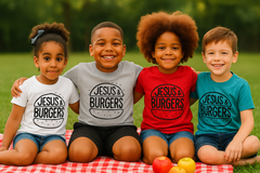 Four children sitting on a blanket with 'Jesus & Burgers' shirts in a park.